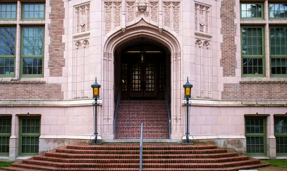 A carved stone archway at the entrance of a university building